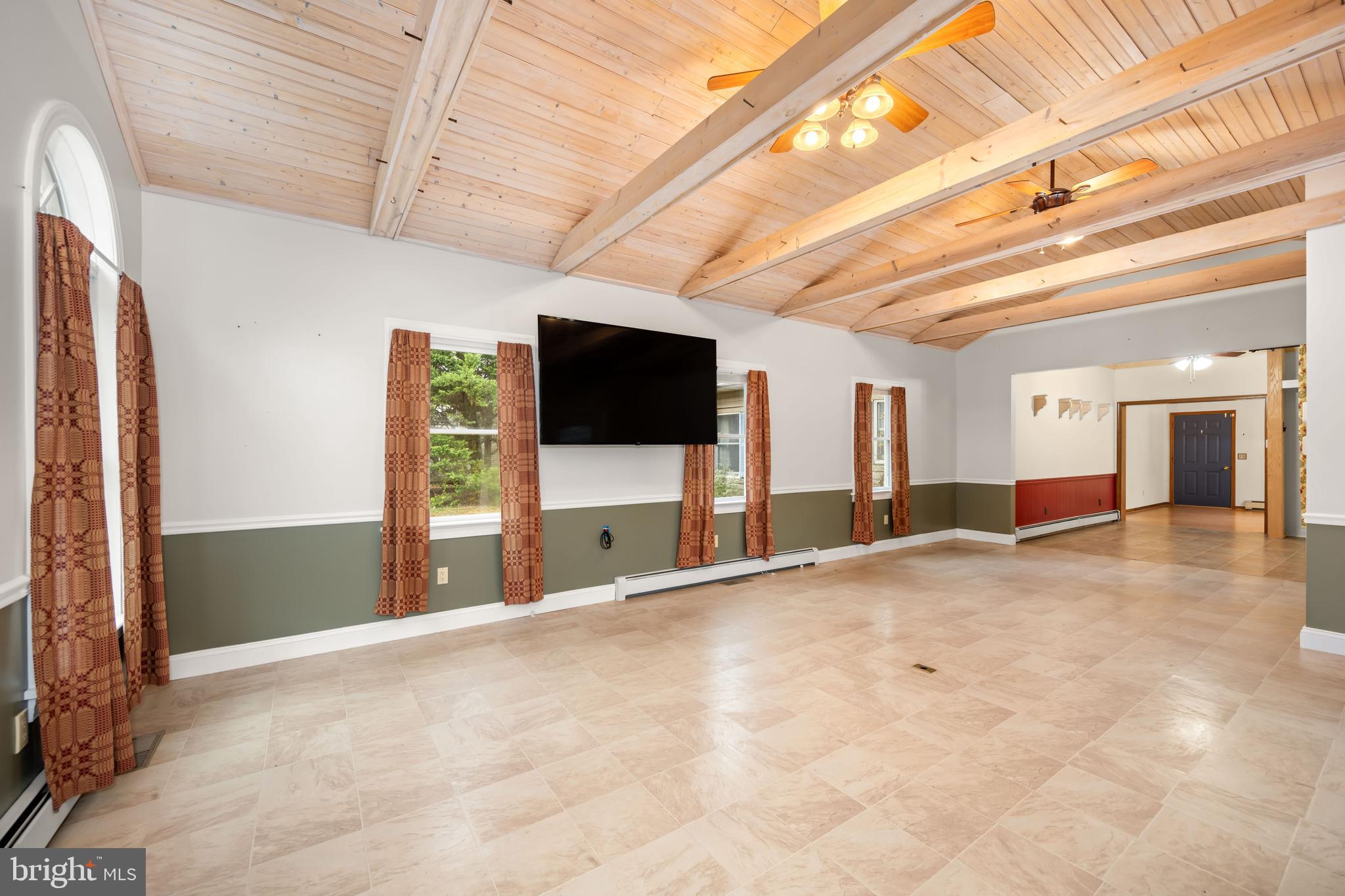 24029 Meadows Drive Ridgely, MD 21660 - Photo 18 of 39 a view of a livingroom with a flat screen tv