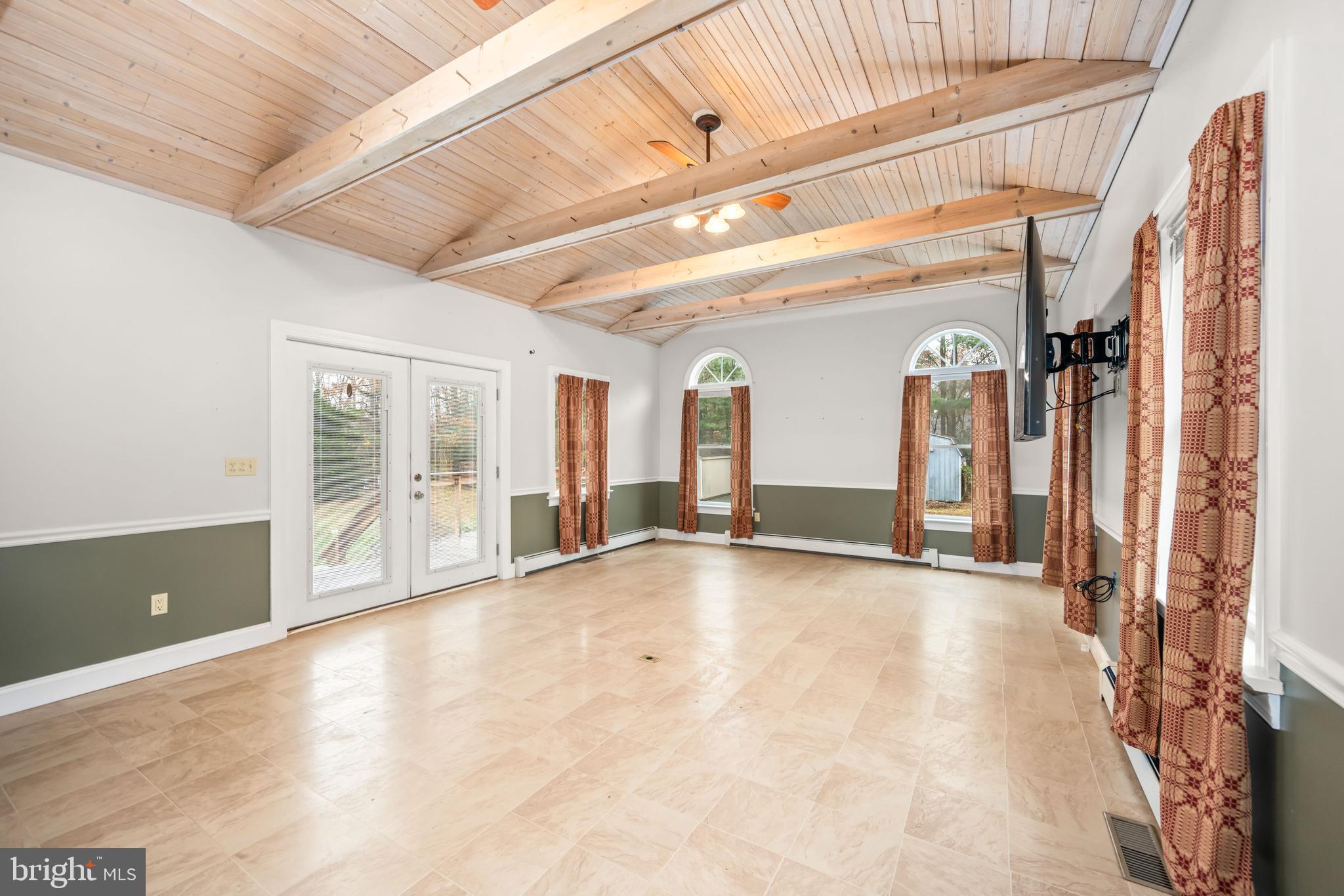 24029 Meadows Drive Ridgely, MD 21660 - Photo 20 of 39 a view of an empty room with windows