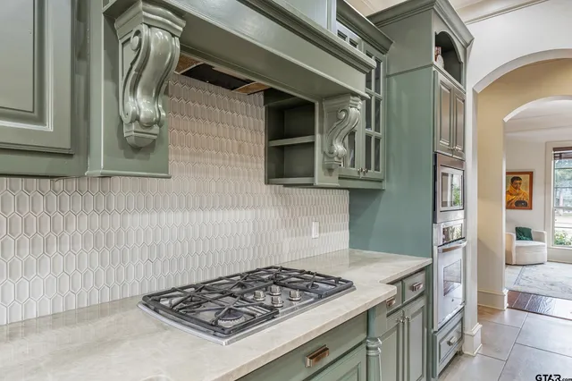 a kitchen with a stove and a microwave