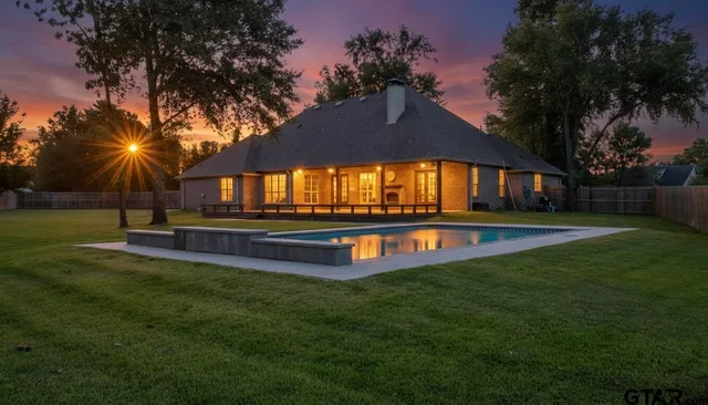 a swimming pool with outdoor seating