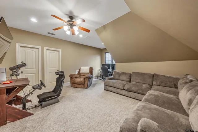 a living room with furniture and white walls