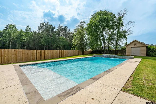 swimming pool with wooden fence
