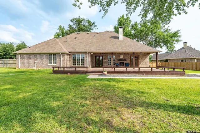 a patio table and chairs with the garden view