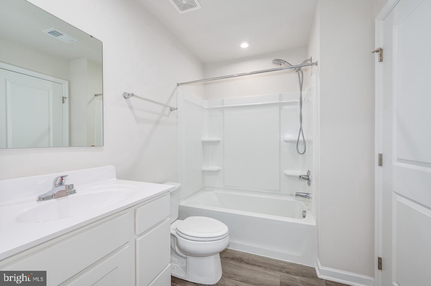 40 Shubunkin Road Inwood, WV 25428 - Photo 26 of 36 a bathroom with a bathtub shower sink vanity and toilet