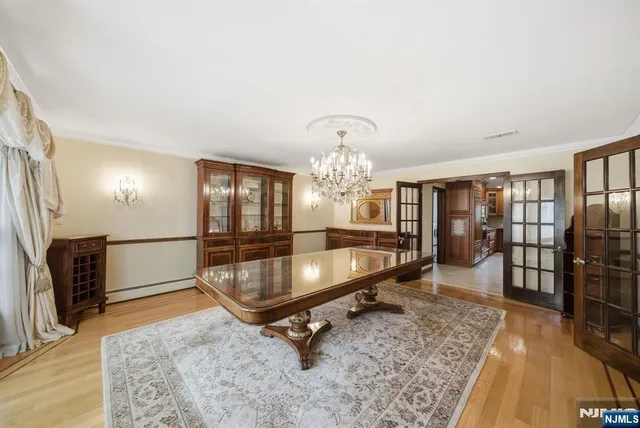 a living room with furniture dining table and a large window