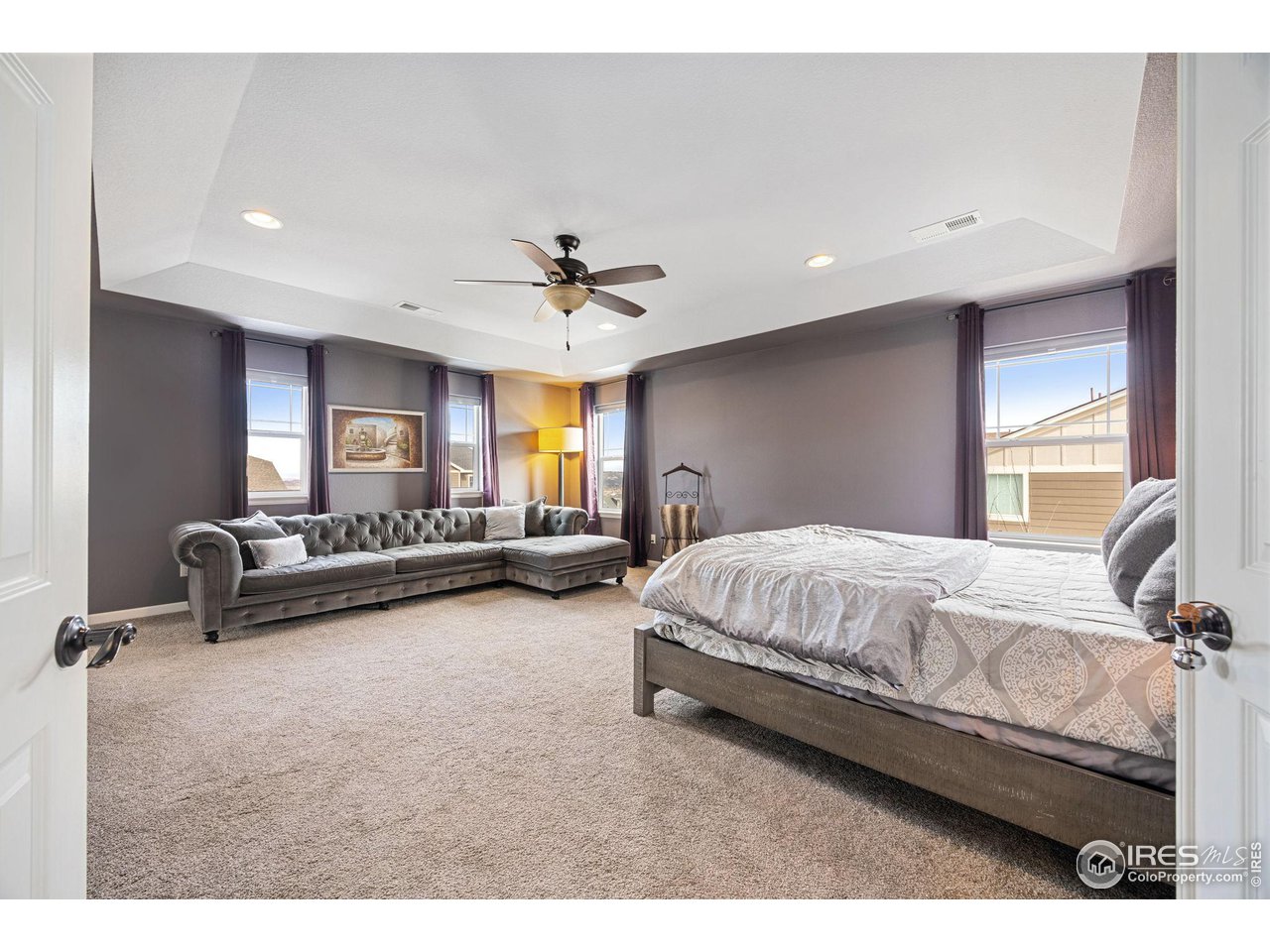 3183 Starry Night Loop Castle Rock, CO 80109 - Photo 16 of 40 a spacious bedroom with a bed and a couch