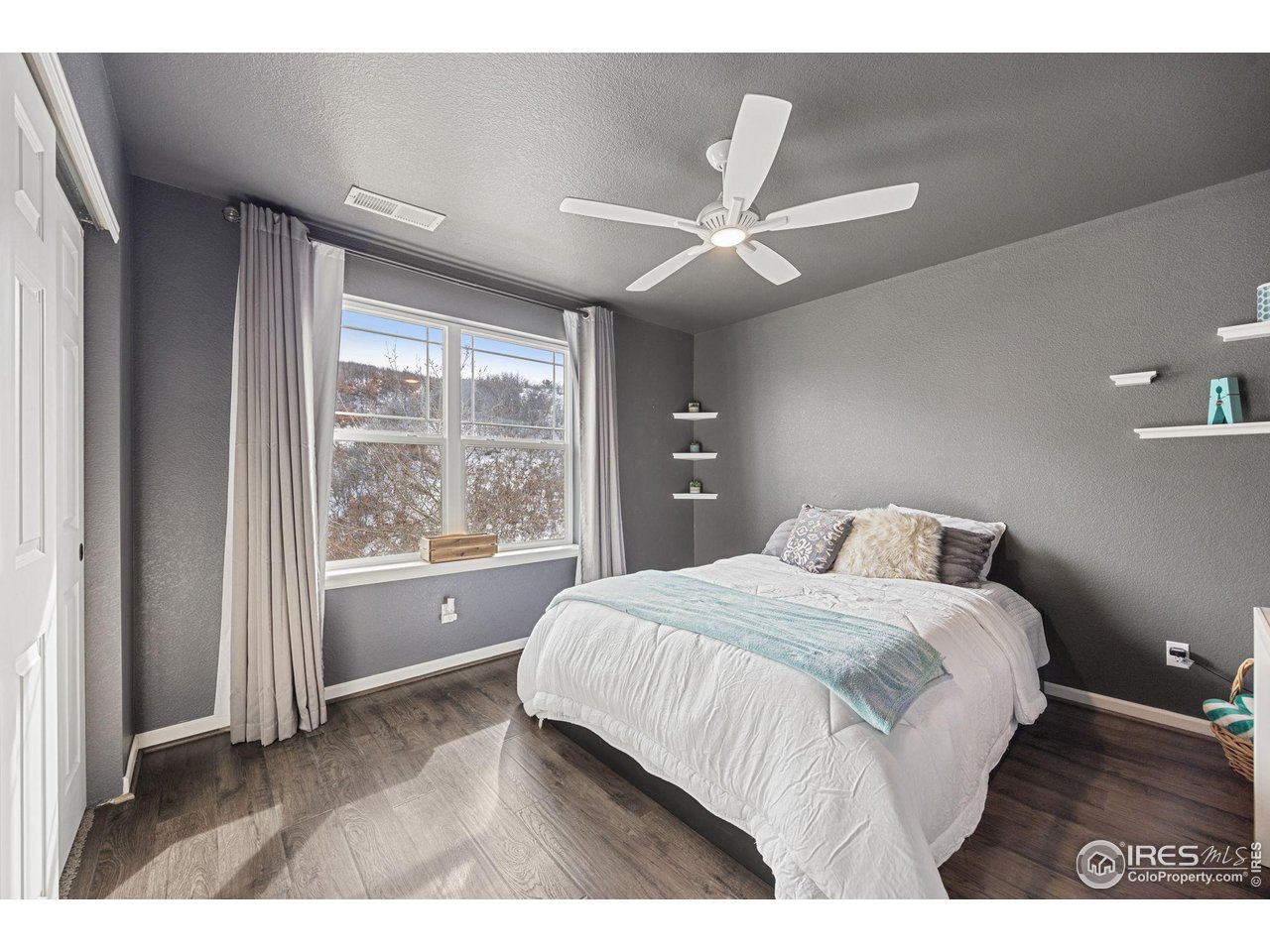3183 Starry Night Loop Castle Rock, CO 80109 - Photo 22 of 40 a bedroom with a large bed and a large window