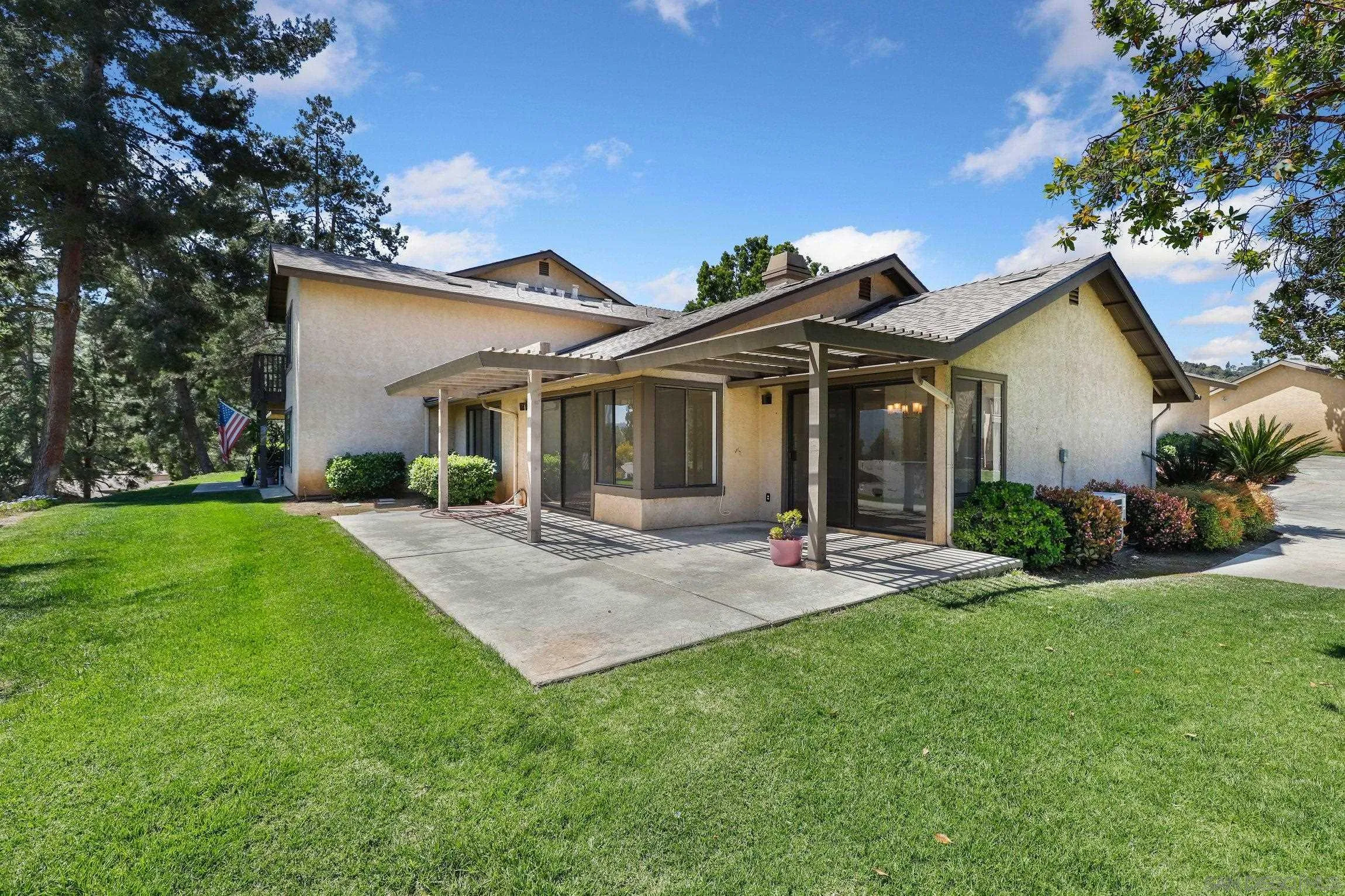 1666 Pala Lake Drive Fallbrook, CA 92028 - Photo 1 of 24 a front view of a house with a garden and patio