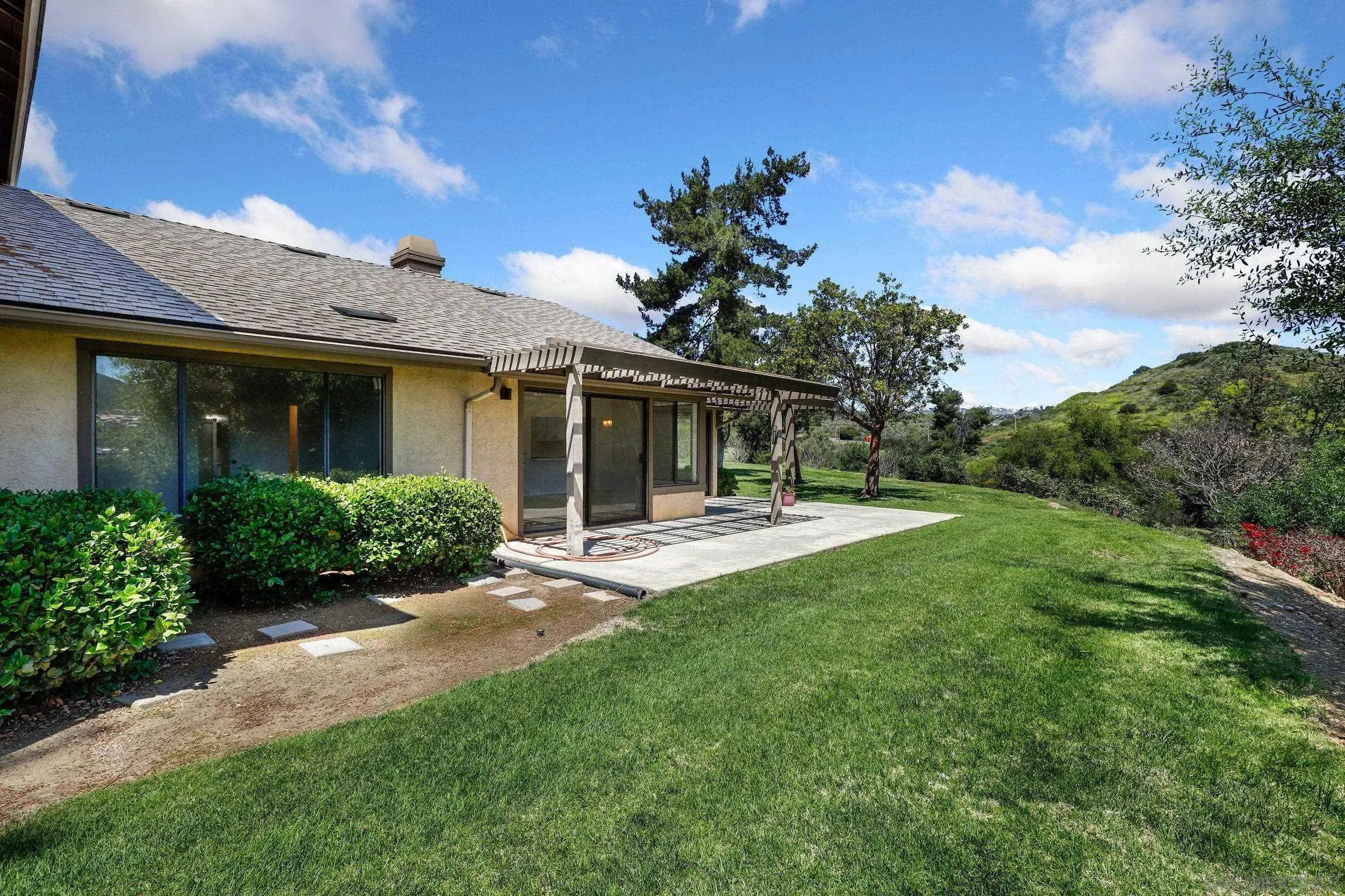 1666 Pala Lake Drive Fallbrook, CA 92028 - Photo 18 of 24 a view of a house with backyard and porch