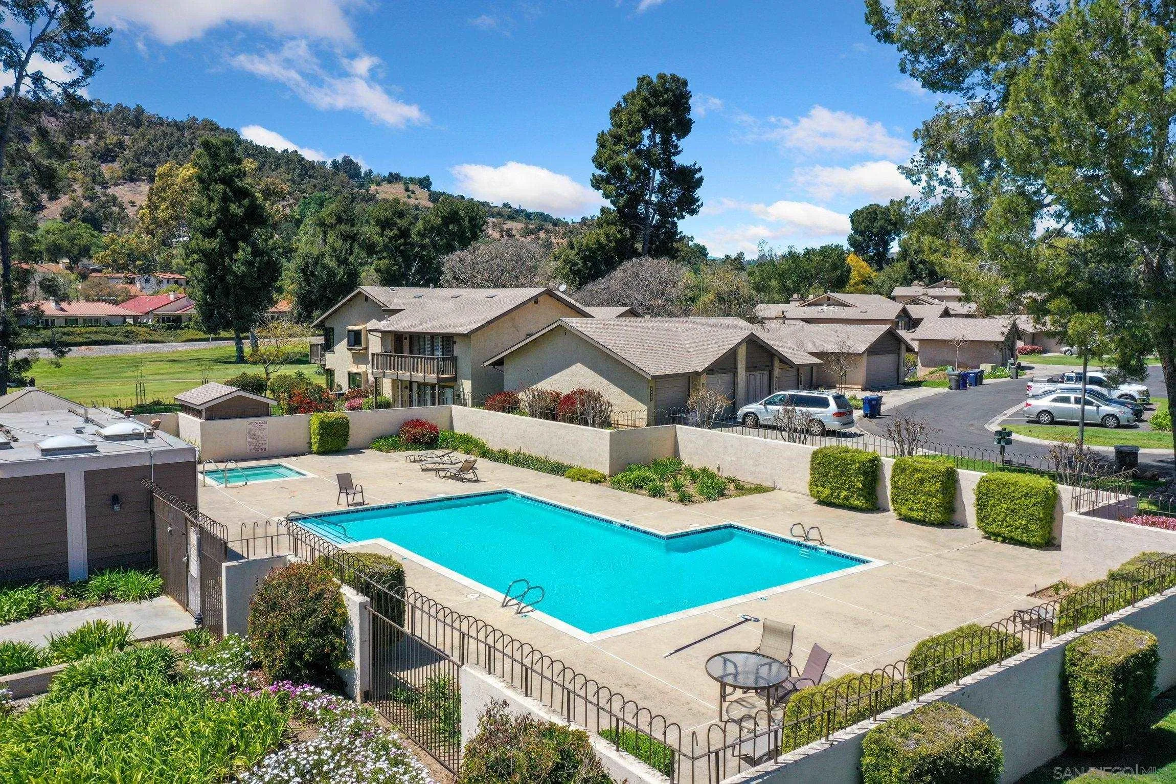 1666 Pala Lake Drive Fallbrook, CA 92028 - Photo 21 of 24 a view of a house with swimming pool and yard