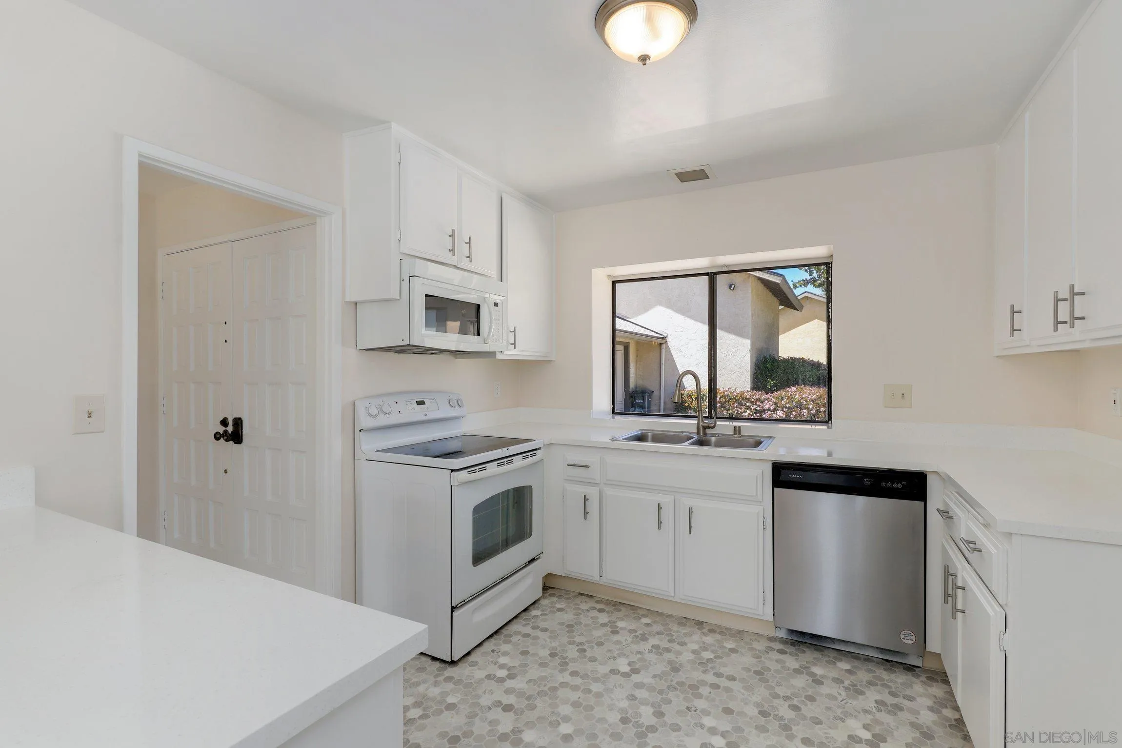 1666 Pala Lake Drive Fallbrook, CA 92028 - Photo 7 of 24 a kitchen with stainless steel appliances granite countertop a stove a sink and a refrigerator