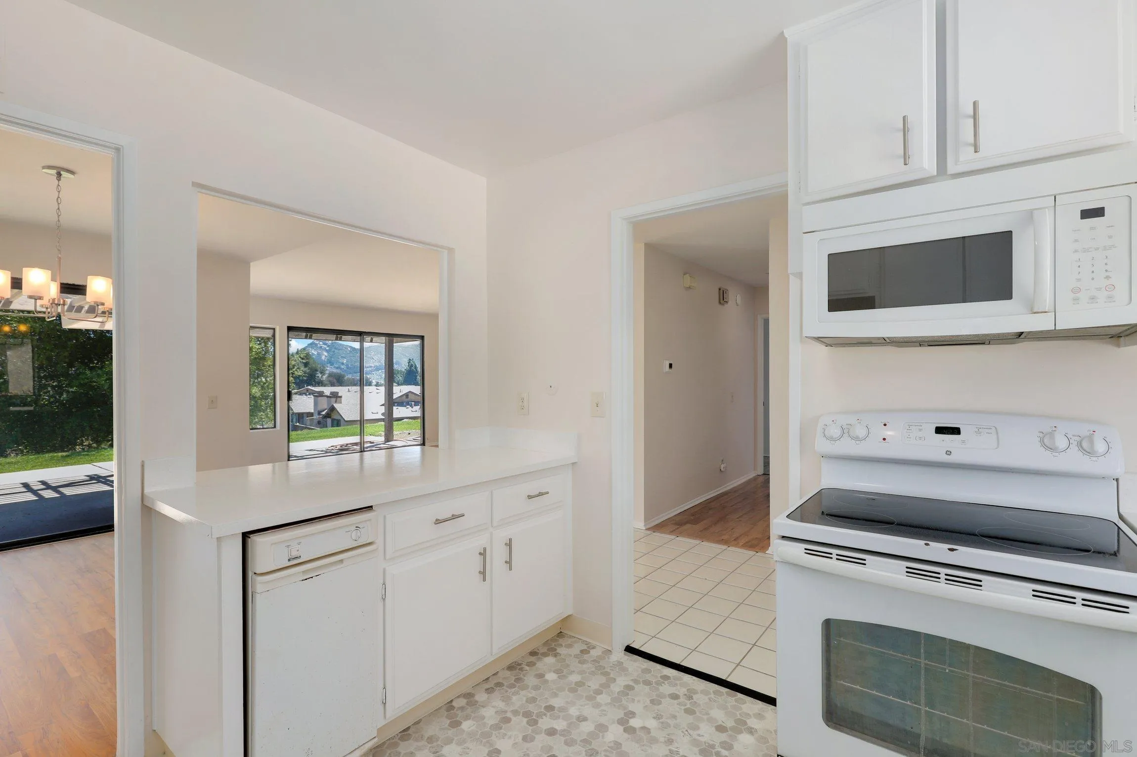 1666 Pala Lake Drive Fallbrook, CA 92028 - Photo 8 of 24 a kitchen with white cabinets and appliances