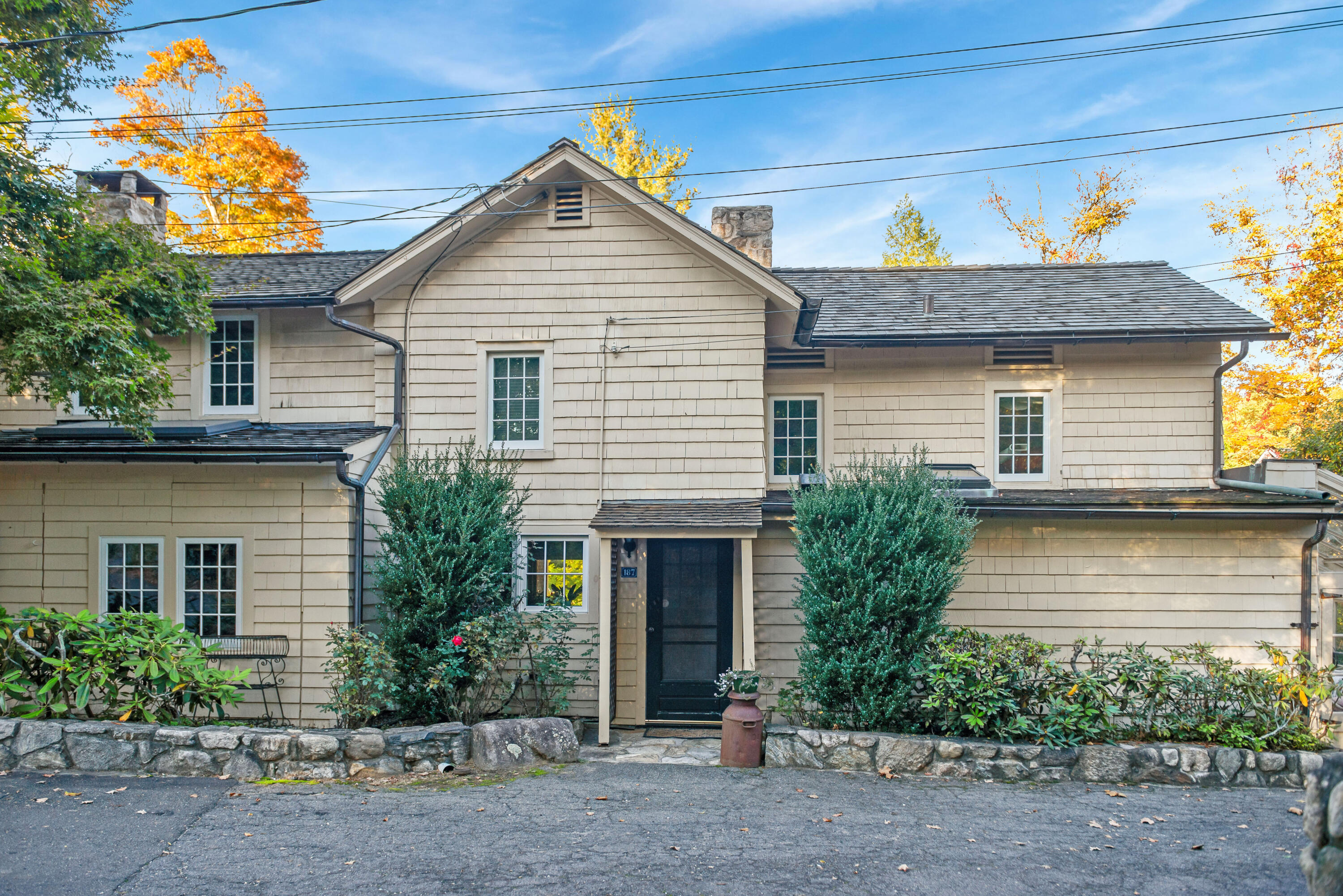 187 Perry Avenue Norwalk, CT 06850 - Photo 2 of 28 a front view of a house with a garden
