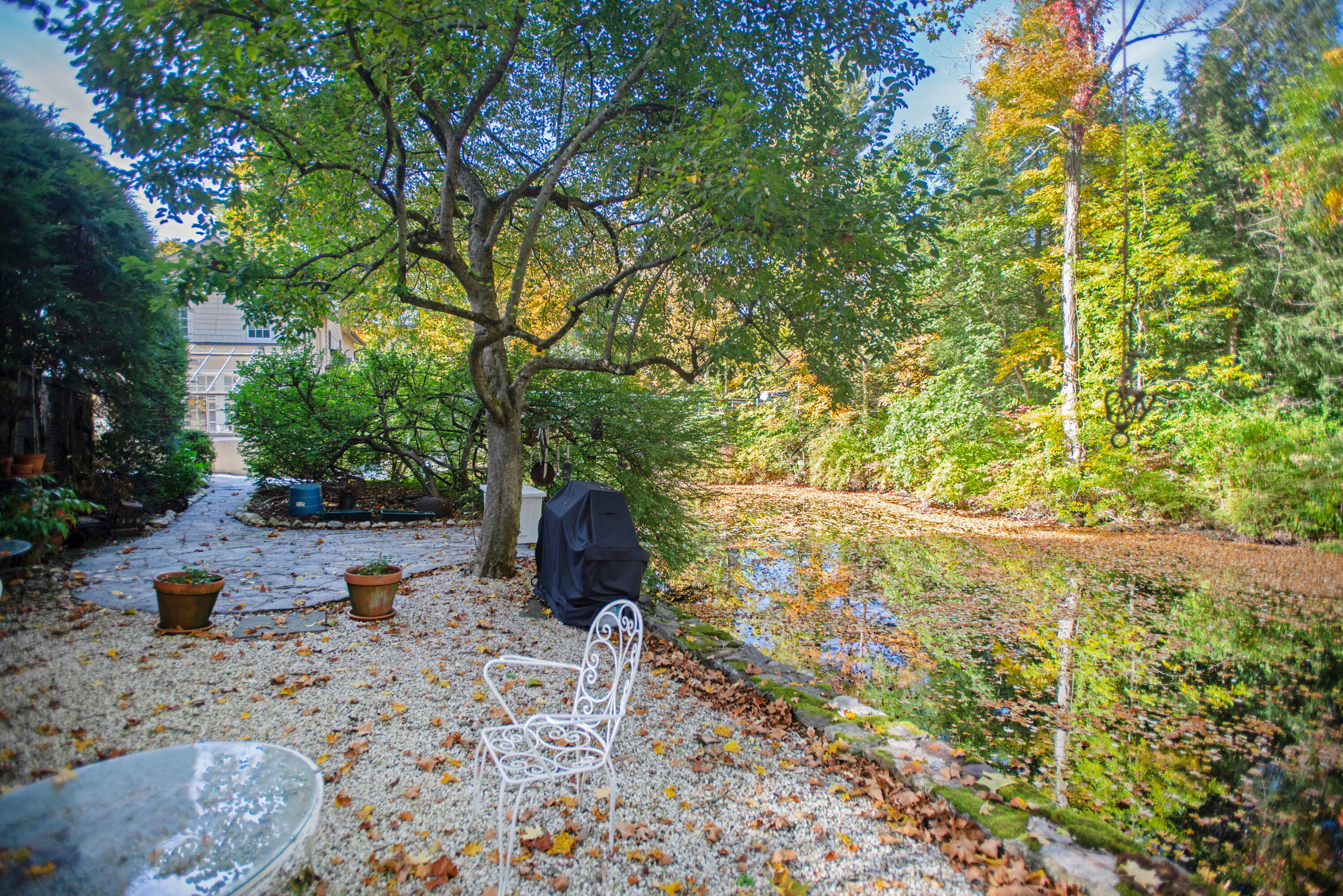 187 Perry Avenue Norwalk, CT 06850 - Photo 26 of 28 a backyard of a house with table and chairs
