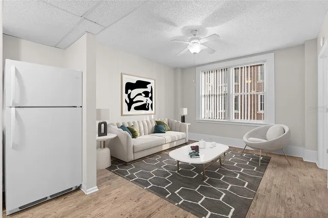 a living room with furniture and a window