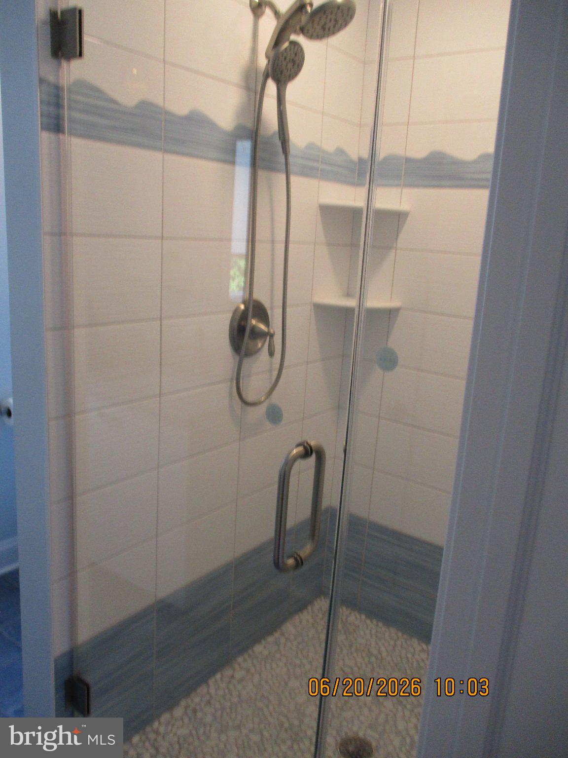 24 West 53rd Street Long Beach Township, NJ 08008 - Photo 58 of 75 Sleek shower with coastal accents.