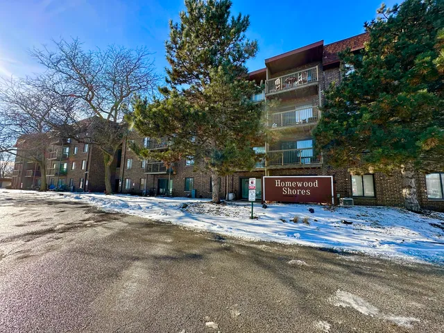 a view of a house with snow on the road