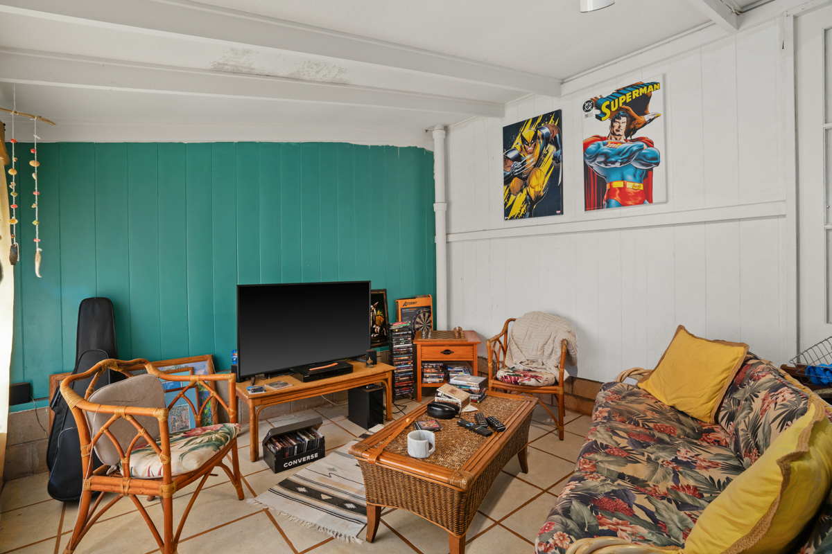 4669 Makeke Road Waimea, HI 96796 - Photo 10 of 24 a living room with furniture and a flat screen tv