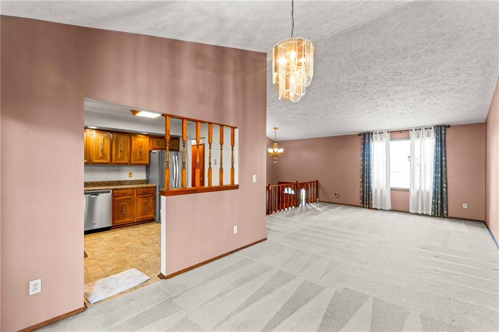 116 Jackson Circle McDonald, PA 15057 - Photo 11 of 33 a view of an empty room with a window and kitchen view