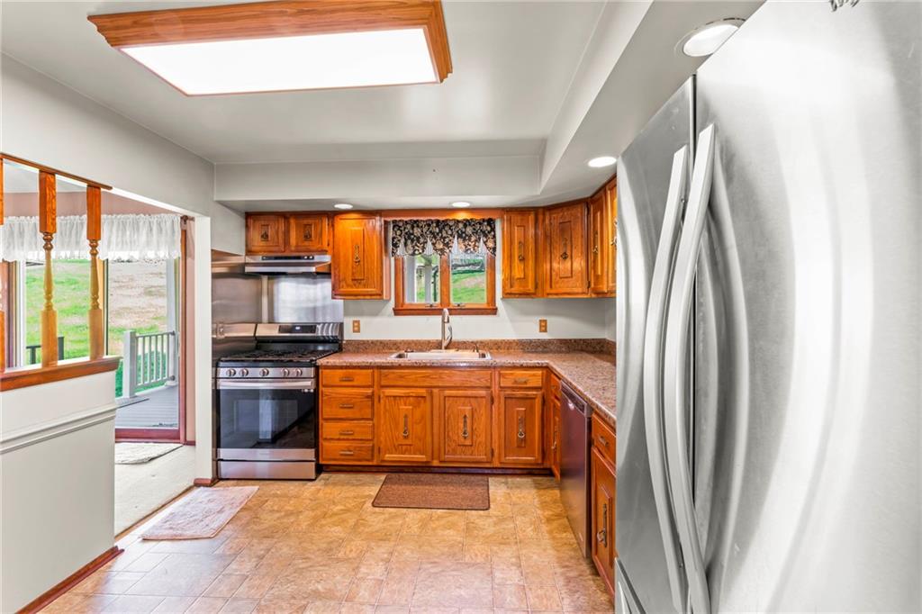 116 Jackson Circle McDonald, PA 15057 - Photo 13 of 33 a large kitchen with stainless steel appliances granite countertop a refrigerator a stove a sink and a window