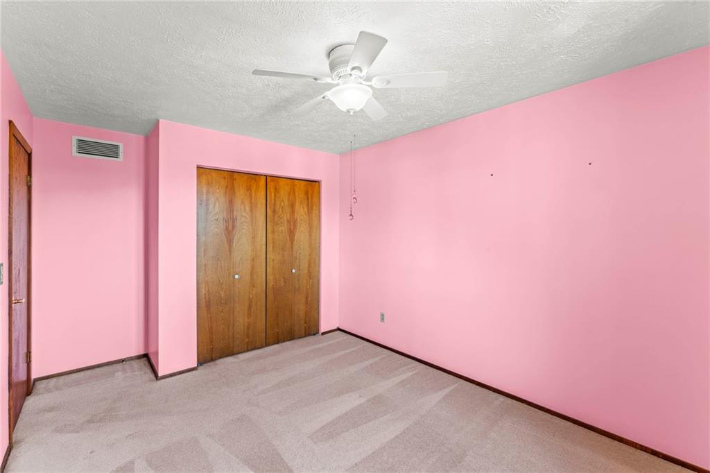 116 Jackson Circle McDonald, PA 15057 - Photo 20 of 33 an empty room with a ceiling fan and a window