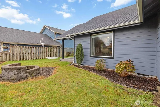a view of a house with a wooden deck