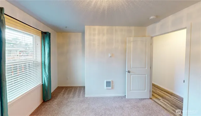 a bathroom with a sink toilet and a mirror