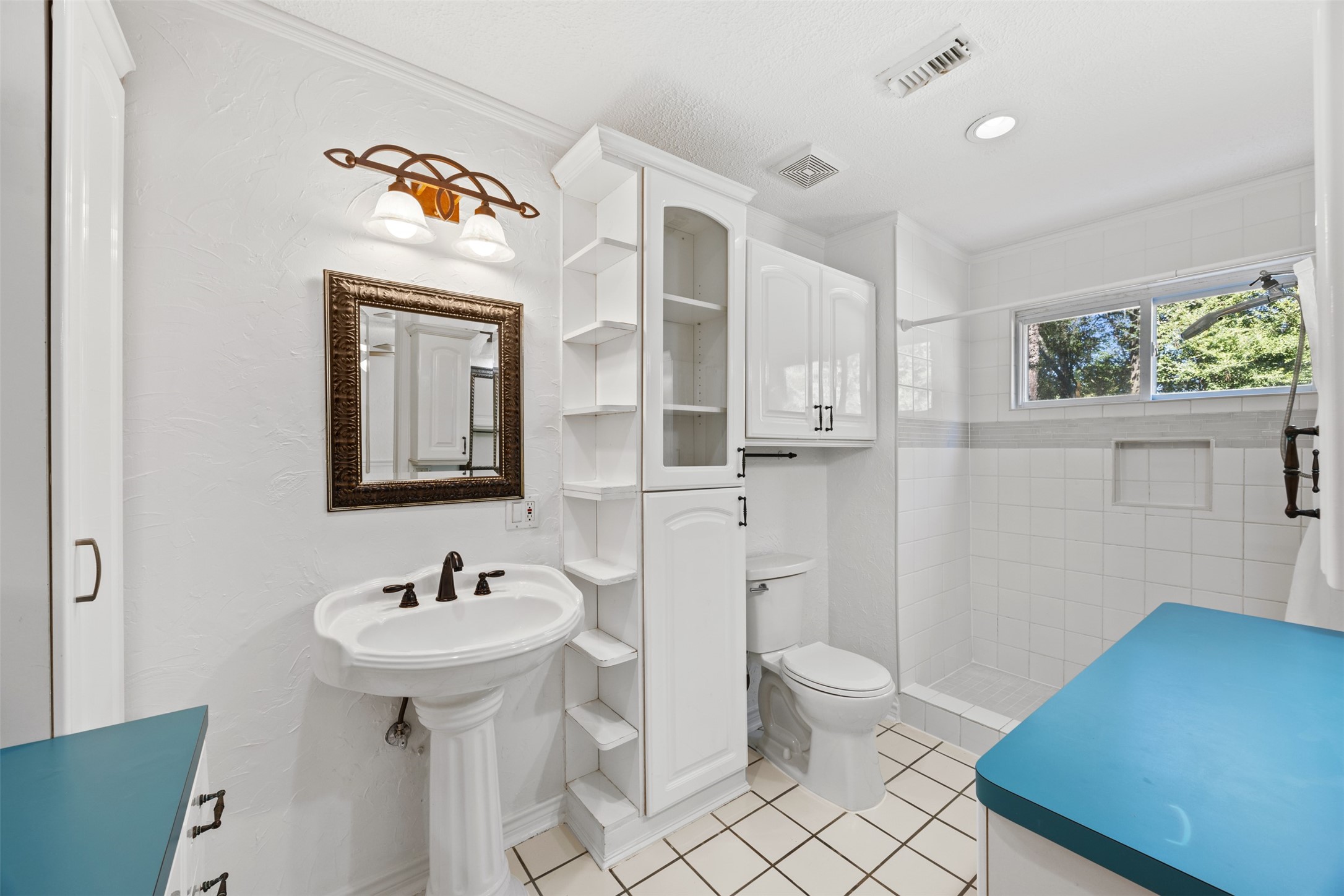 12 Dewthread Court Spring, TX 77380 - Photo 13 of 24 a bathroom with a sink a toilet and shower