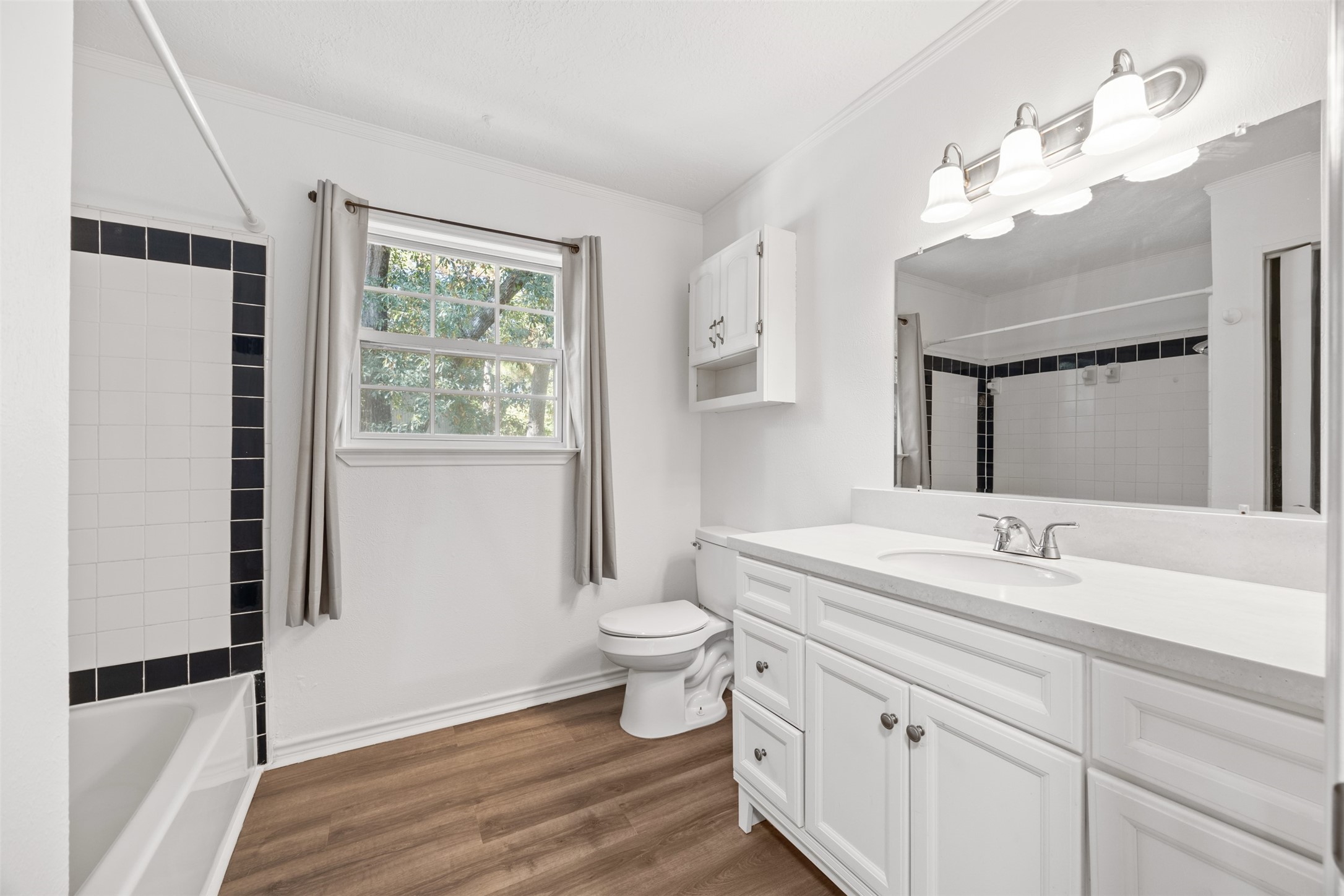 12 Dewthread Court Spring, TX 77380 - Photo 17 of 24 a bathroom with a sink a toilet and a mirror