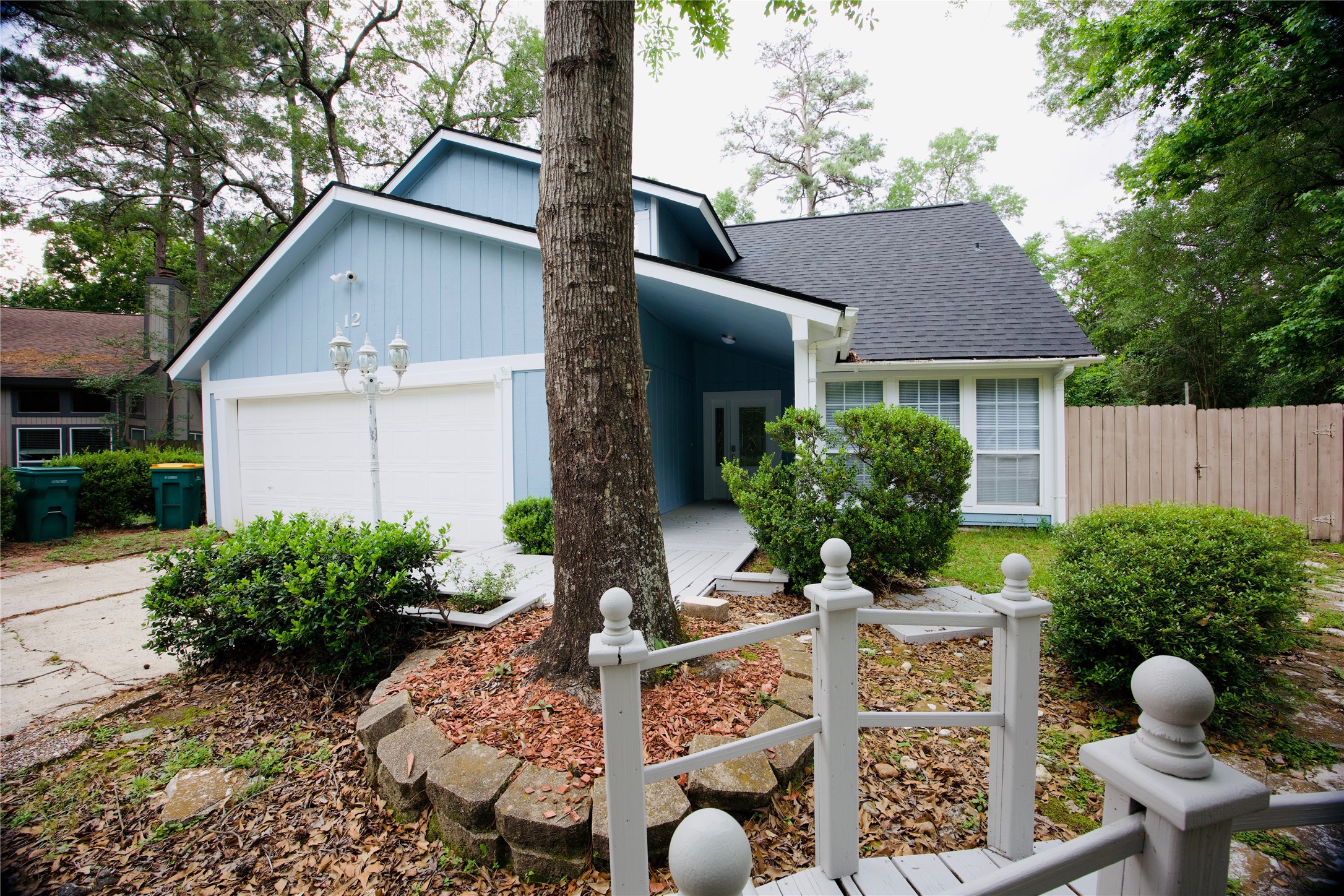 12 Dewthread Court Spring, TX 77380 - Photo 2 of 22 a front view of house with yard and trees around