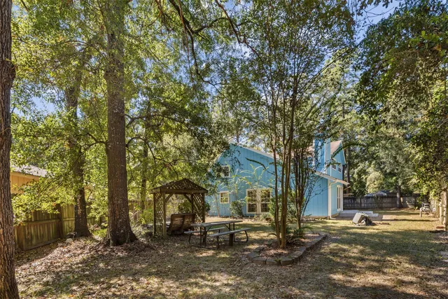 a view of a building with a large tree