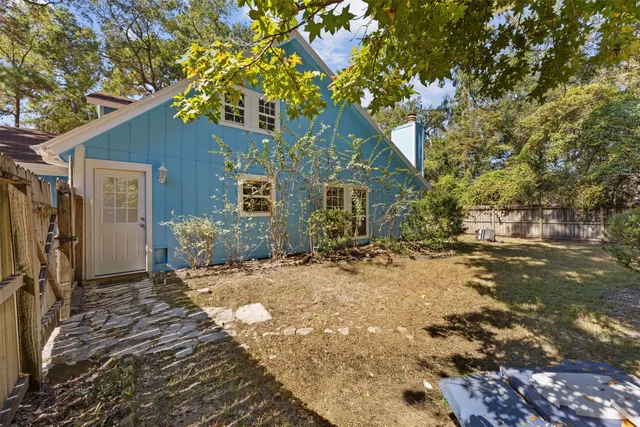 a house with a tree in front of it