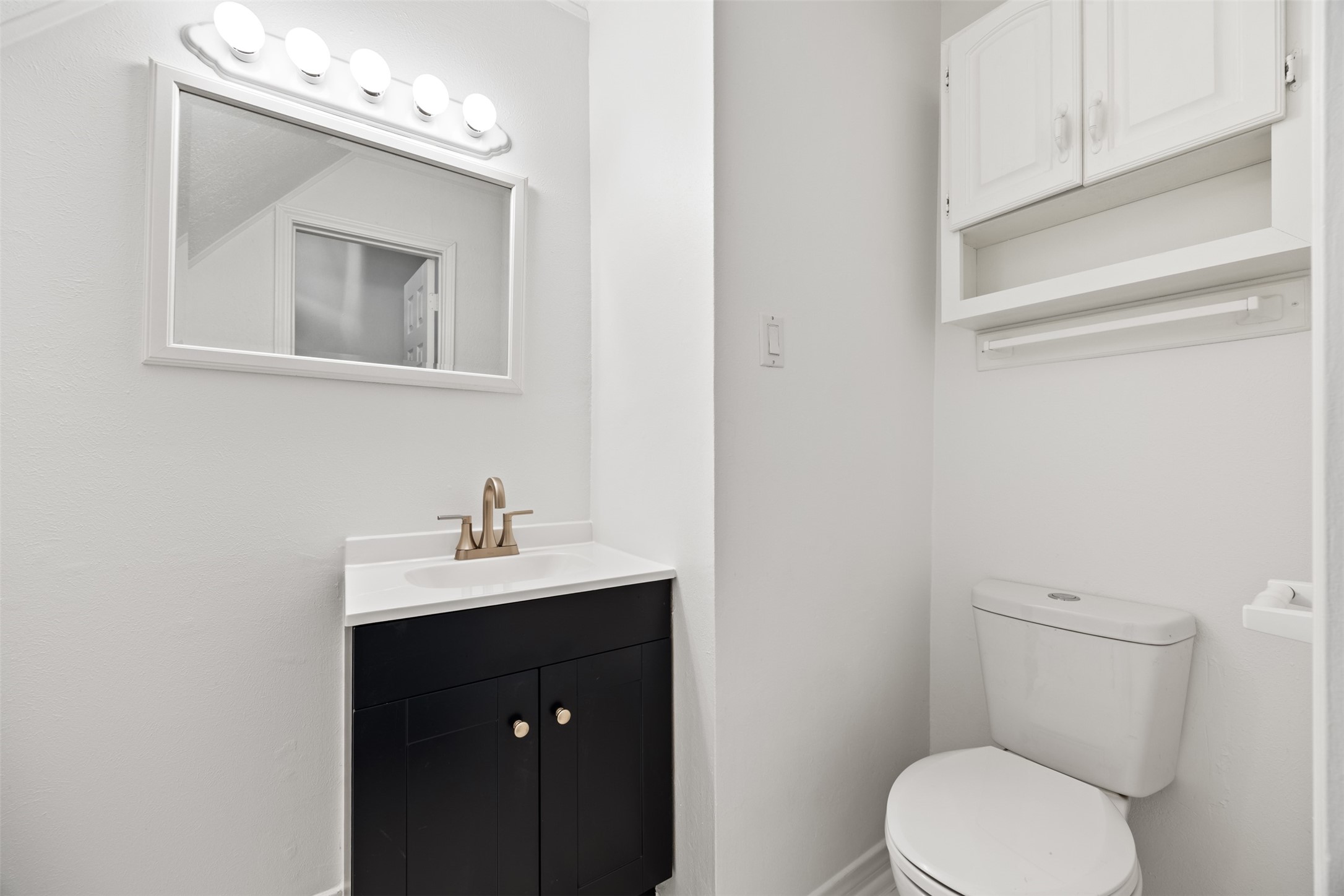12 Dewthread Court Spring, TX 77380 - Photo 8 of 22 a bathroom with a toilet sink and mirror
