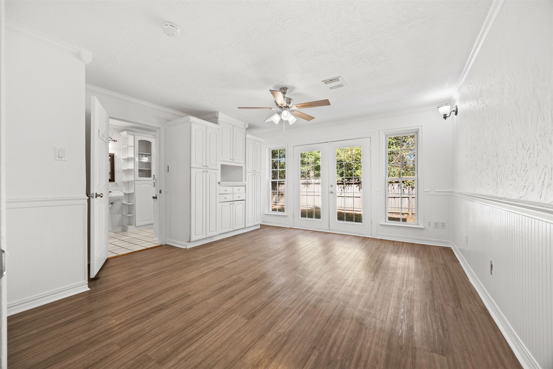 12 Dewthread Court Spring, TX 77380 - Photo 9 of 22 wooden floor in an empty room with a window