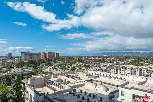 a kitchen with stainless steel appliances granite countertop a refrigerator and a stove