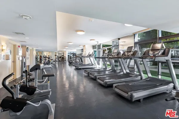 a view of a patio with couches chairs table and chairs