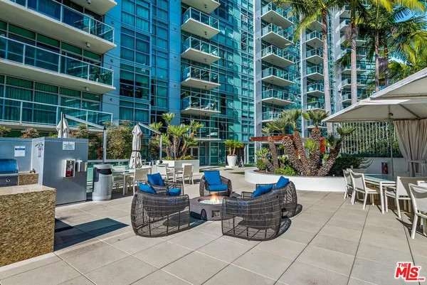a view of a swimming pool with a lounge chairs