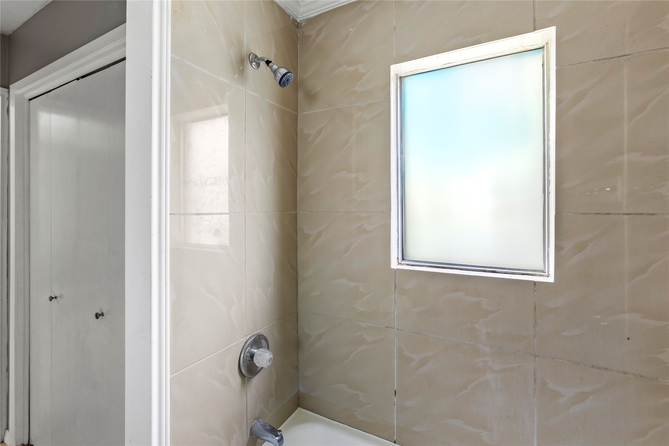 1825 Bayou Road La Marque, TX 77568 - Photo 13 of 15 a bathroom with a shower and a window