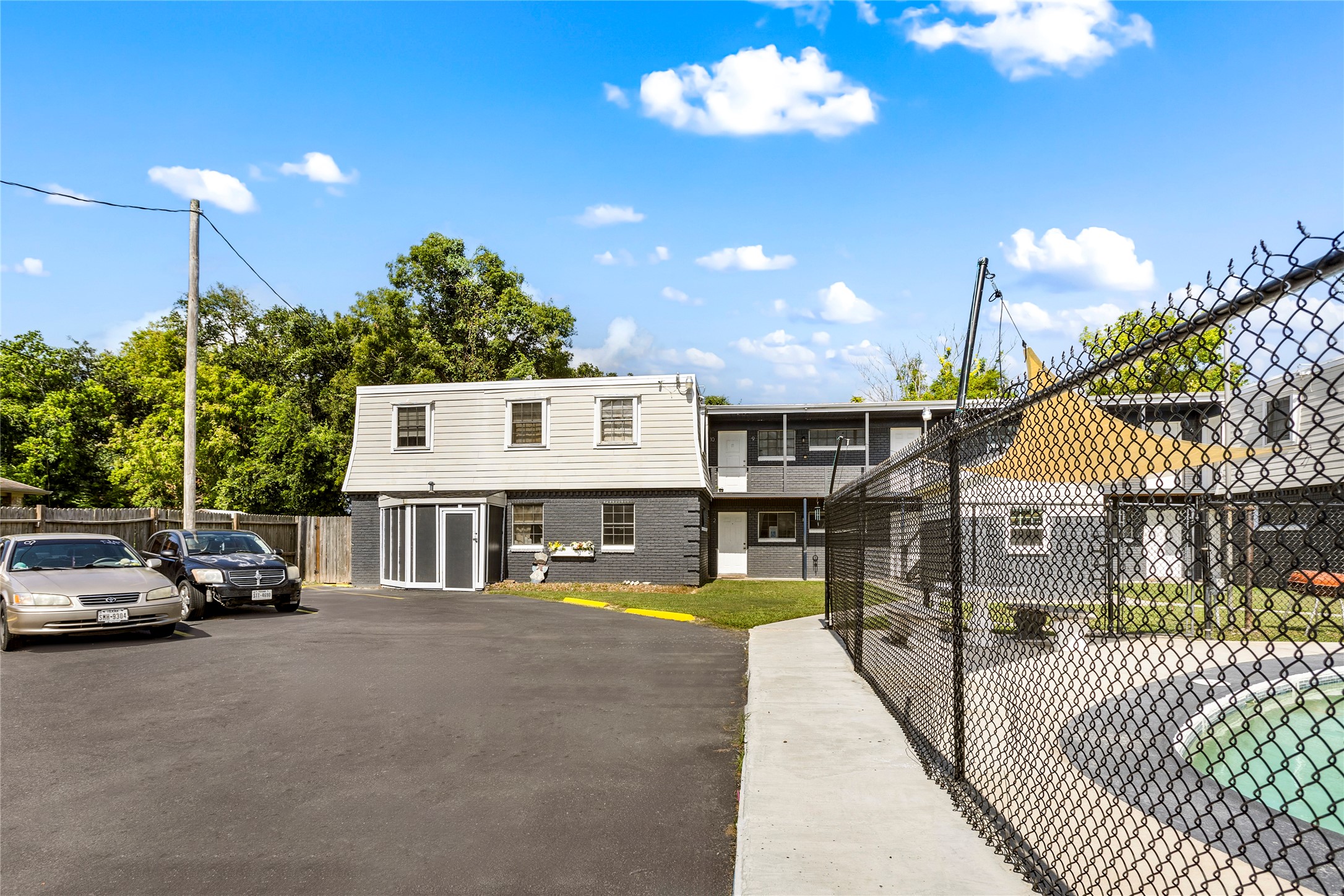 1825 Bayou Road La Marque, TX 77568 - Photo 2 of 15 a view of a house with swimming pool and sitting area