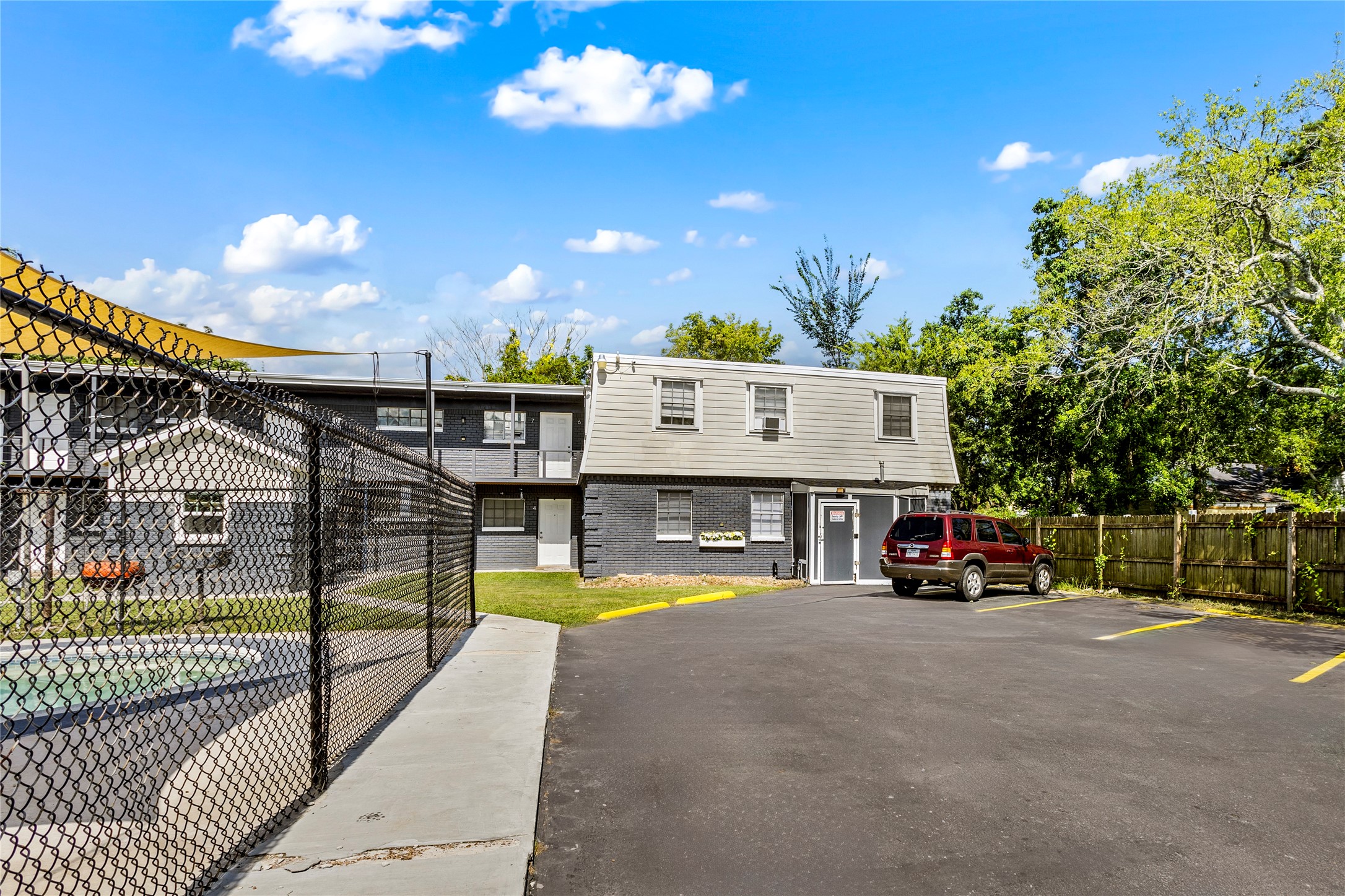 1825 Bayou Road La Marque, TX 77568 - Photo 5 of 15 a view of a swimming pool with a patio and a yard