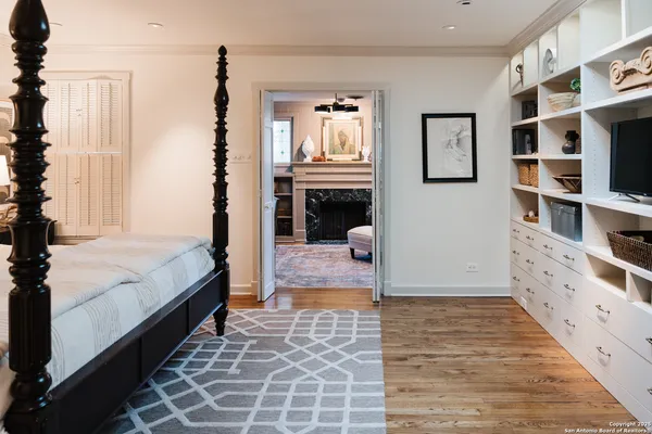 a bedroom with furniture and window