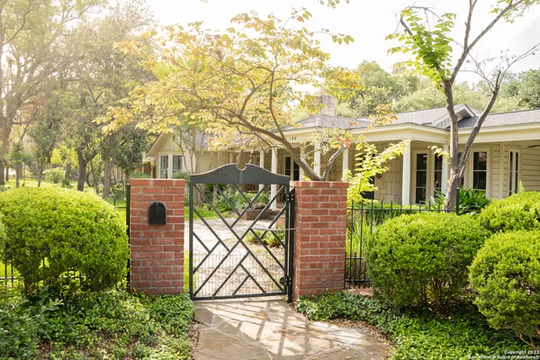 front view of a house with a tree
