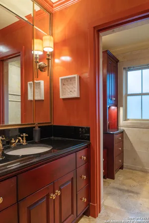 a bathroom with a sink and a mirror