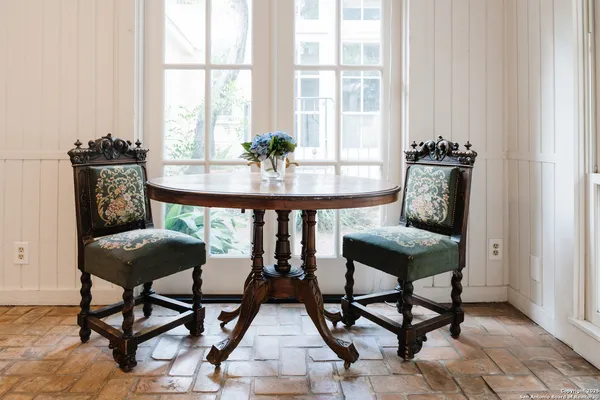 a work room with furniture and a window