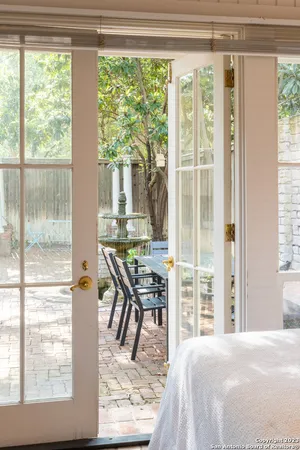 a living room with a large window and table