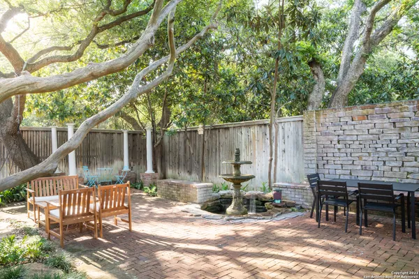 a view of backyard with a table and chairs