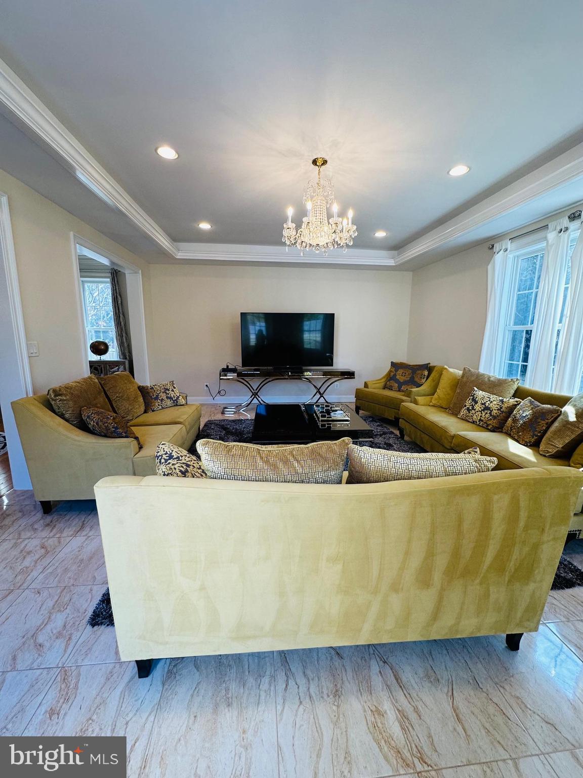 6413 Divine Street McLean, VA 22101 - Photo 23 of 60 a living room with furniture and kitchen view