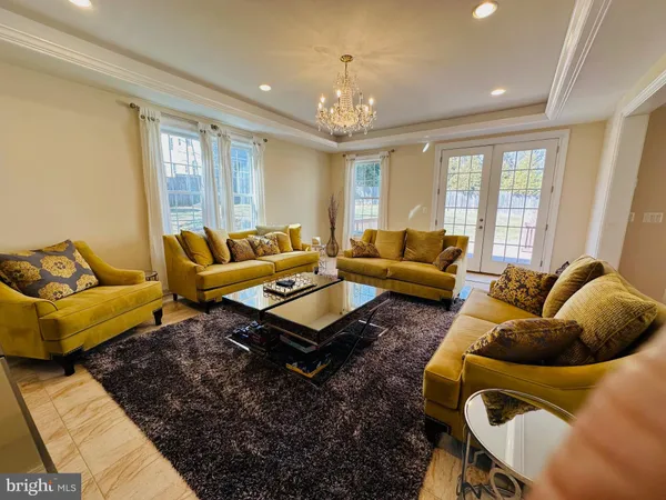 a view of livingroom with hardwood floor and ceiling fan