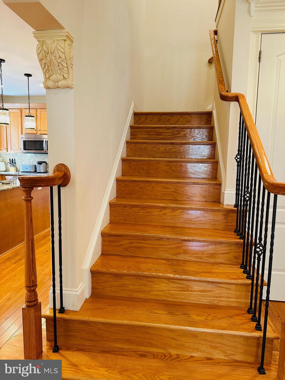 6413 Divine Street McLean, VA 22101 - Photo 27 of 60 a view of entryway and hall with wooden floor
