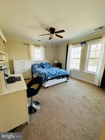 a living room with hard wood floors and a table